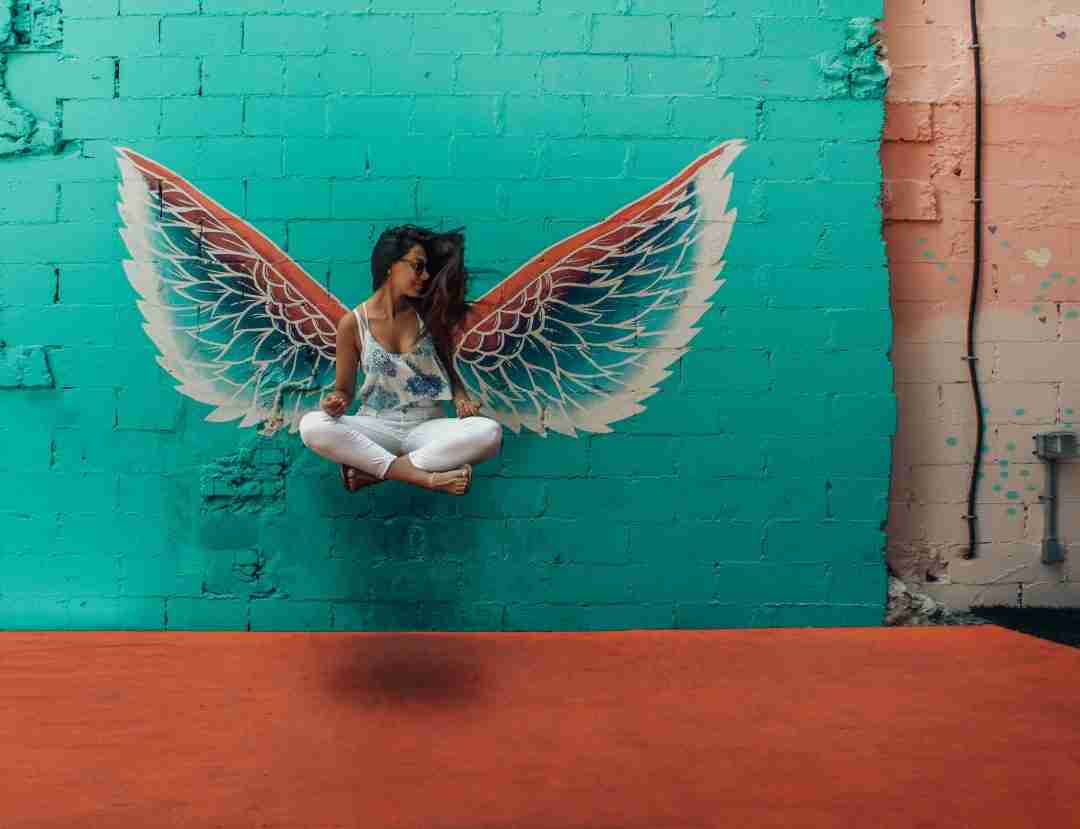 designecologist-781651-unsplash Woman suspended with butterfly wings
